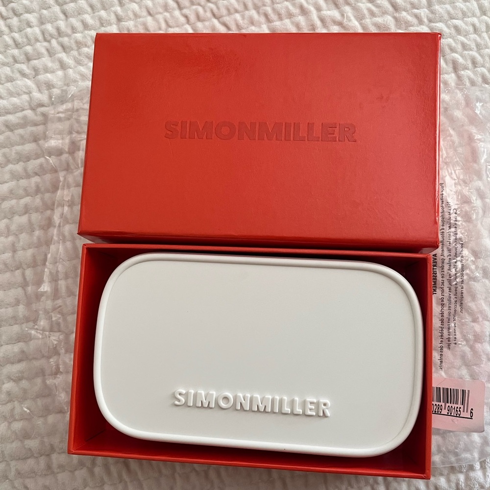 Simón Miller pill clutch in macadamia